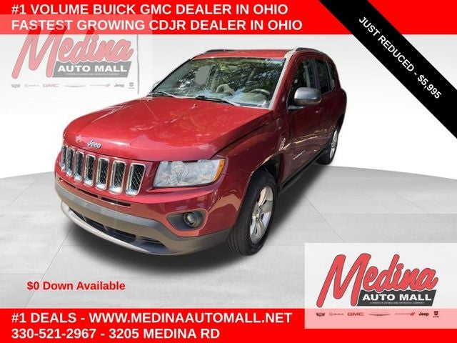 2012 Jeep Compass Sport in Deep Cherry Red Crystal Pearlcoat — front three-quarter view