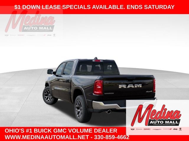 2026 RAM 1500 Laramie in Diamond Black Crystal Pearlcoat — front three-quarter view