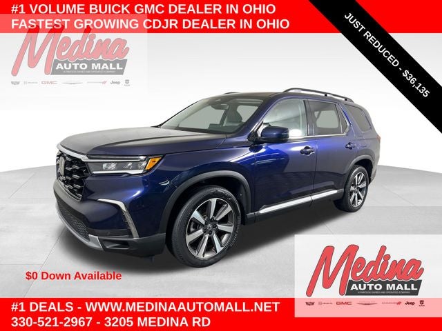2023 Honda Pilot Touring in Obsidian Blue — front three-quarter view