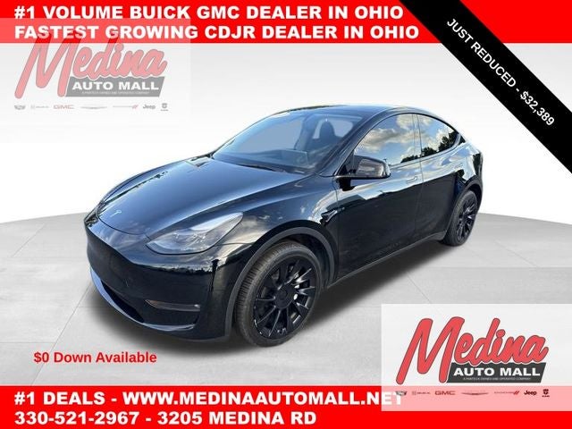 2023 Tesla Model Y Long Range in Solid Black — front three-quarter view